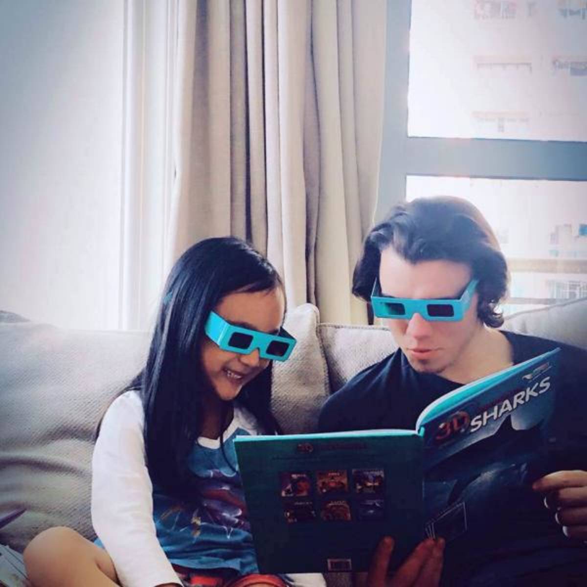 Au pair is writing Chinese with kid 