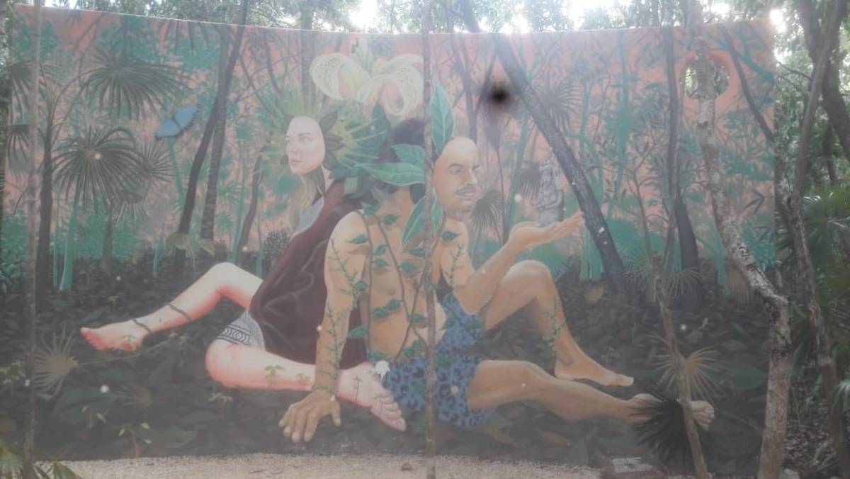 Mural of three people sitting down