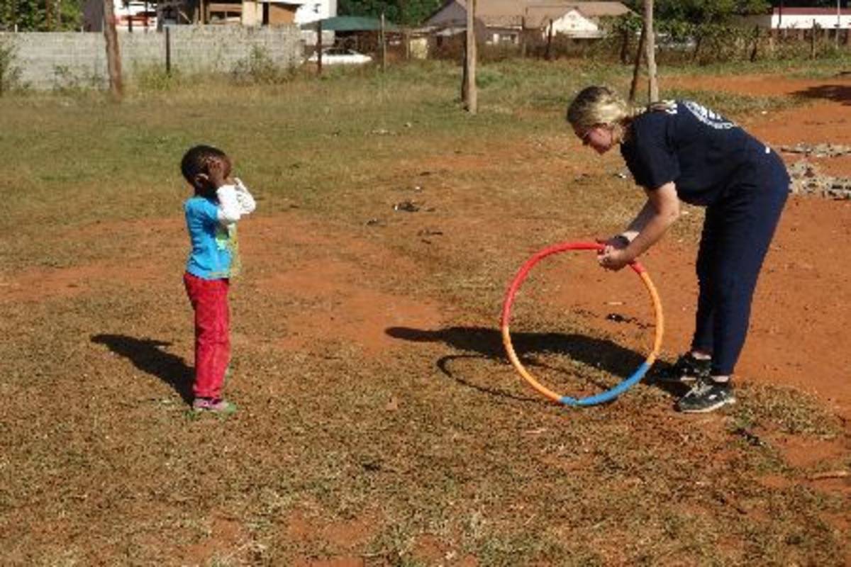 child anticipate hula hoop roll