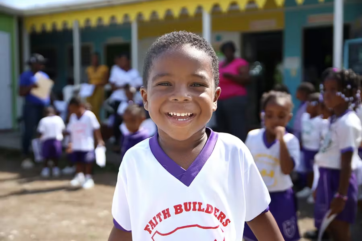 Child Smiling for a Photo in the Childcare Program St Mary Jamaica