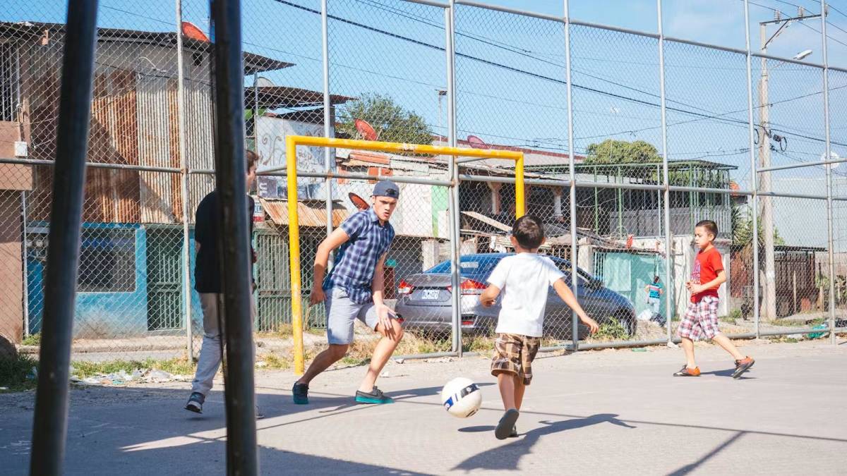 Children Playing Football on a Street Pitch in Costa Rica
