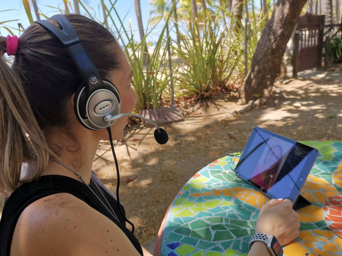 an online language lesson by the beach