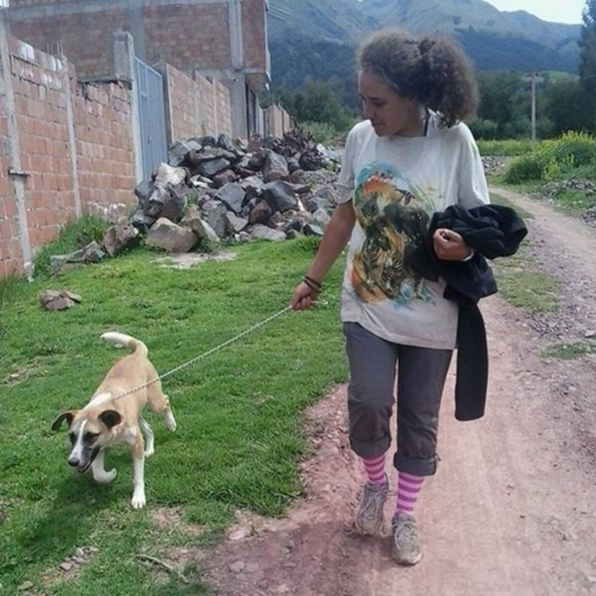 A woman walking her dog