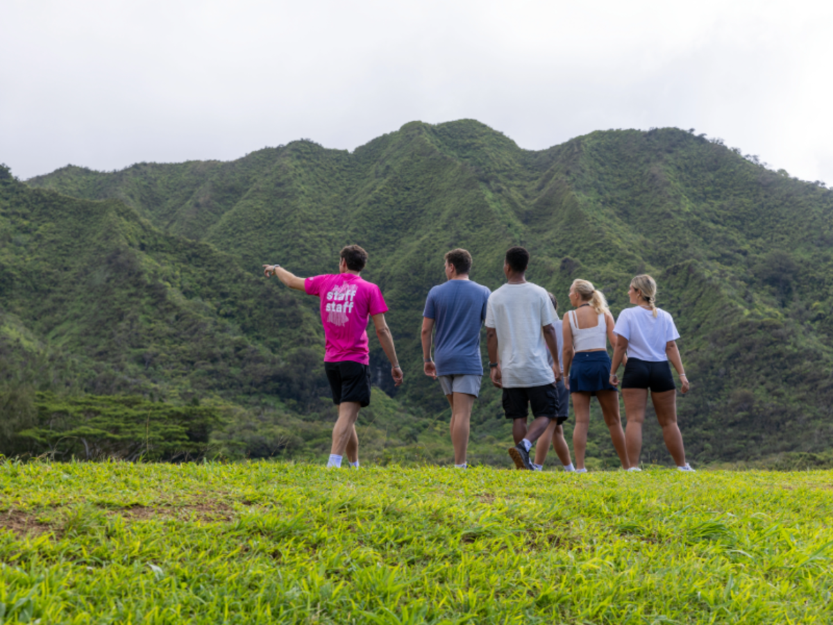 EF students hike with a staff guide through the lush green mountains of Playa Tamarindo, Costa Rica.