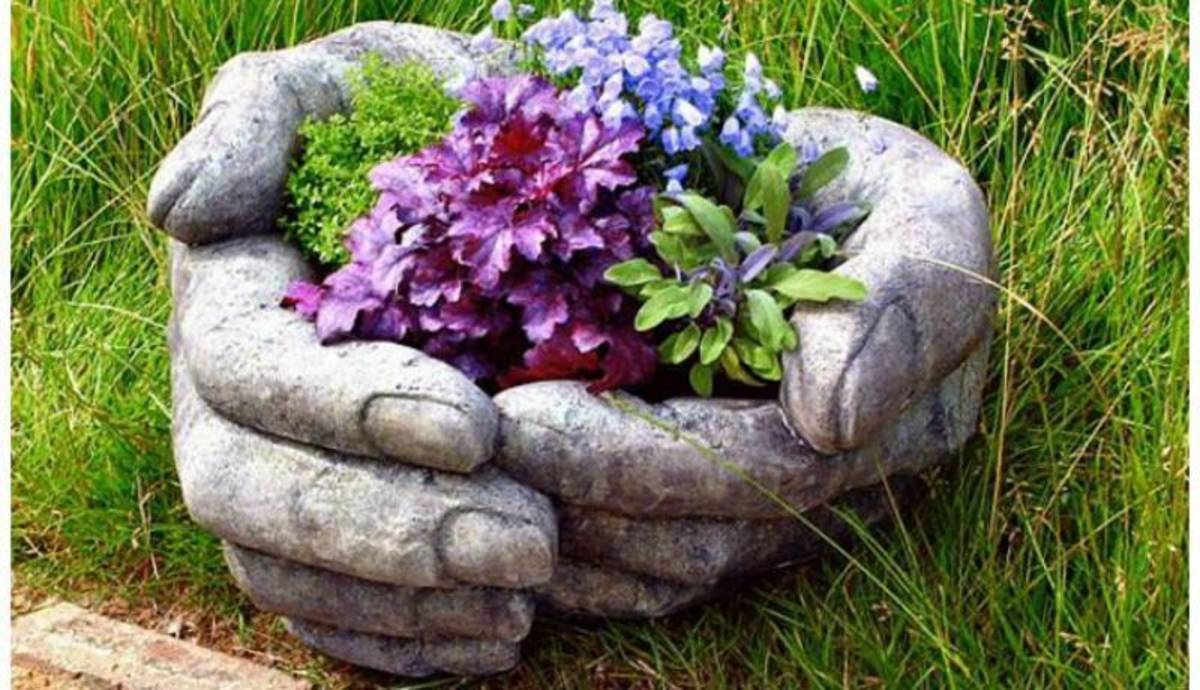 Giant hands scooping flowers