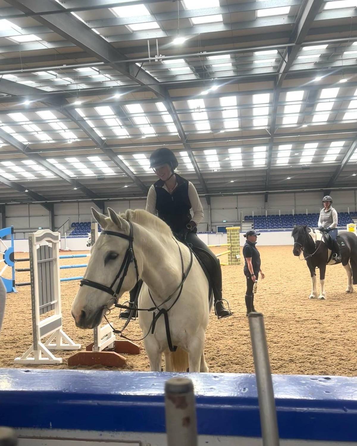 equine student riding her horse