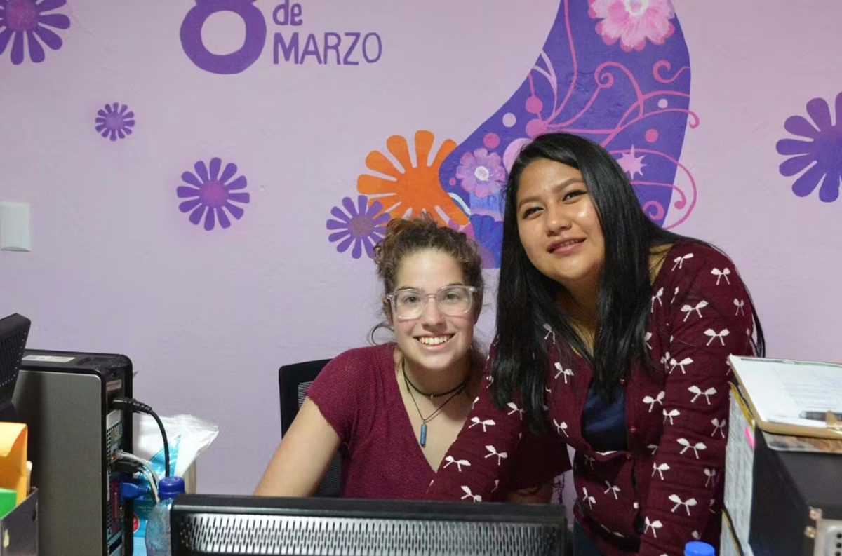 Female Volunteer Helping a Woman with their Small Business