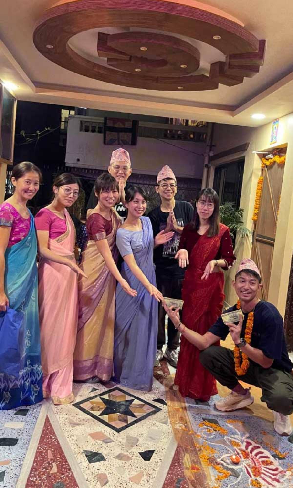 Fully immersed. Interns join local celebrations dressed in traditional Nepali wear.