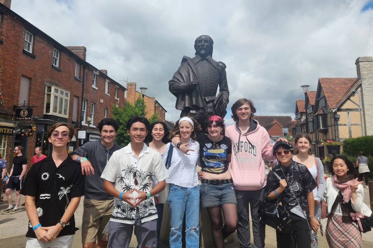 FYA students in Statford next to statue