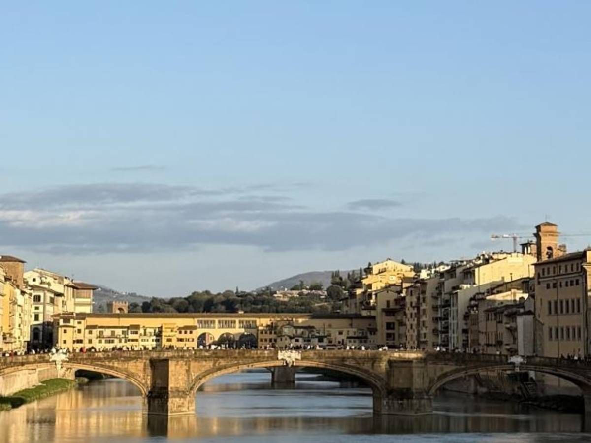 Gazing out at the river in Florence, Italy.