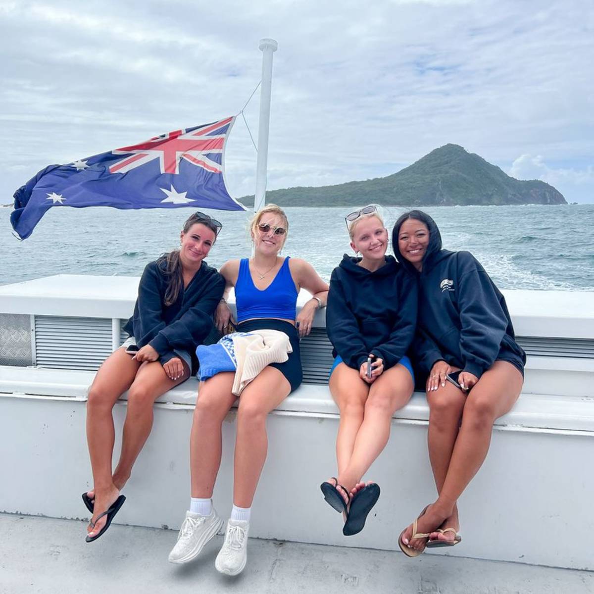 Girls on a boat traveling to island off coast of Australia