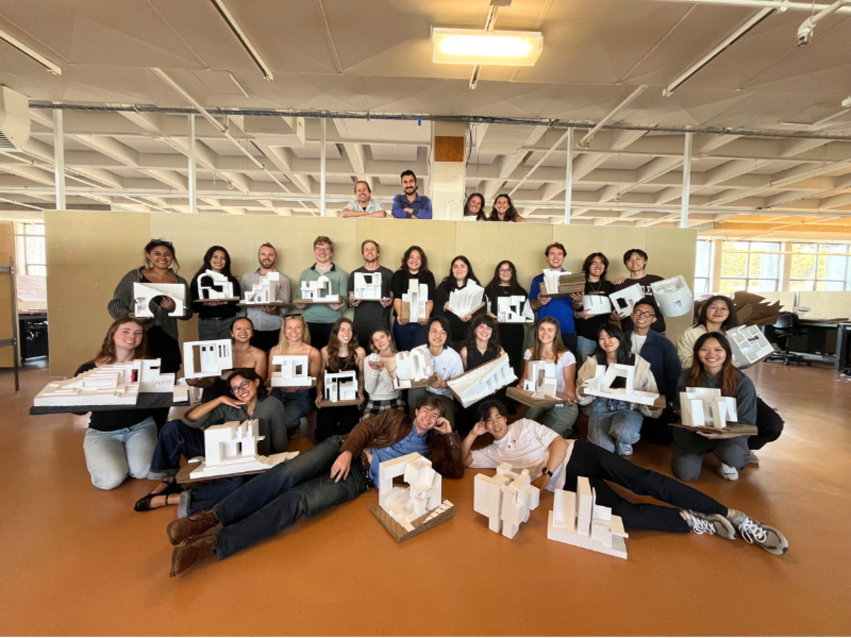 Group of architecture students with their models and four instructors