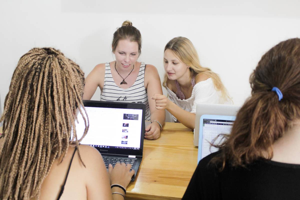 group of people discussing around a table