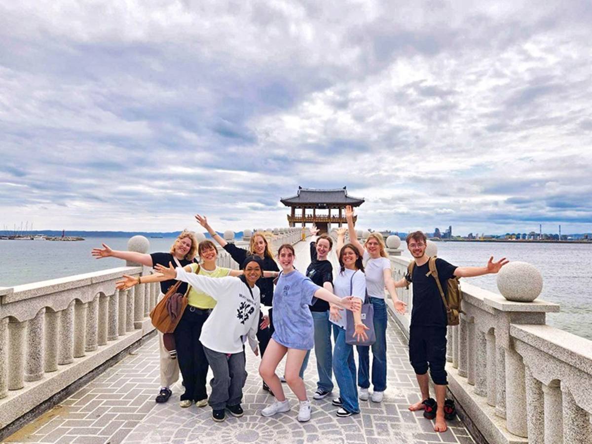 Group of people on a stone boardwalk