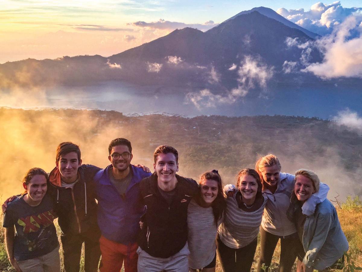 Group photo in front of mountain in Indonesia