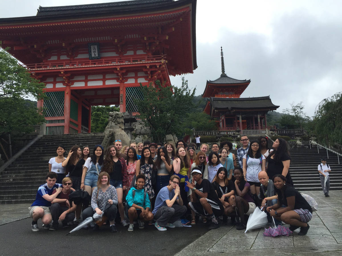High school students posing in front of temple in Kyoto