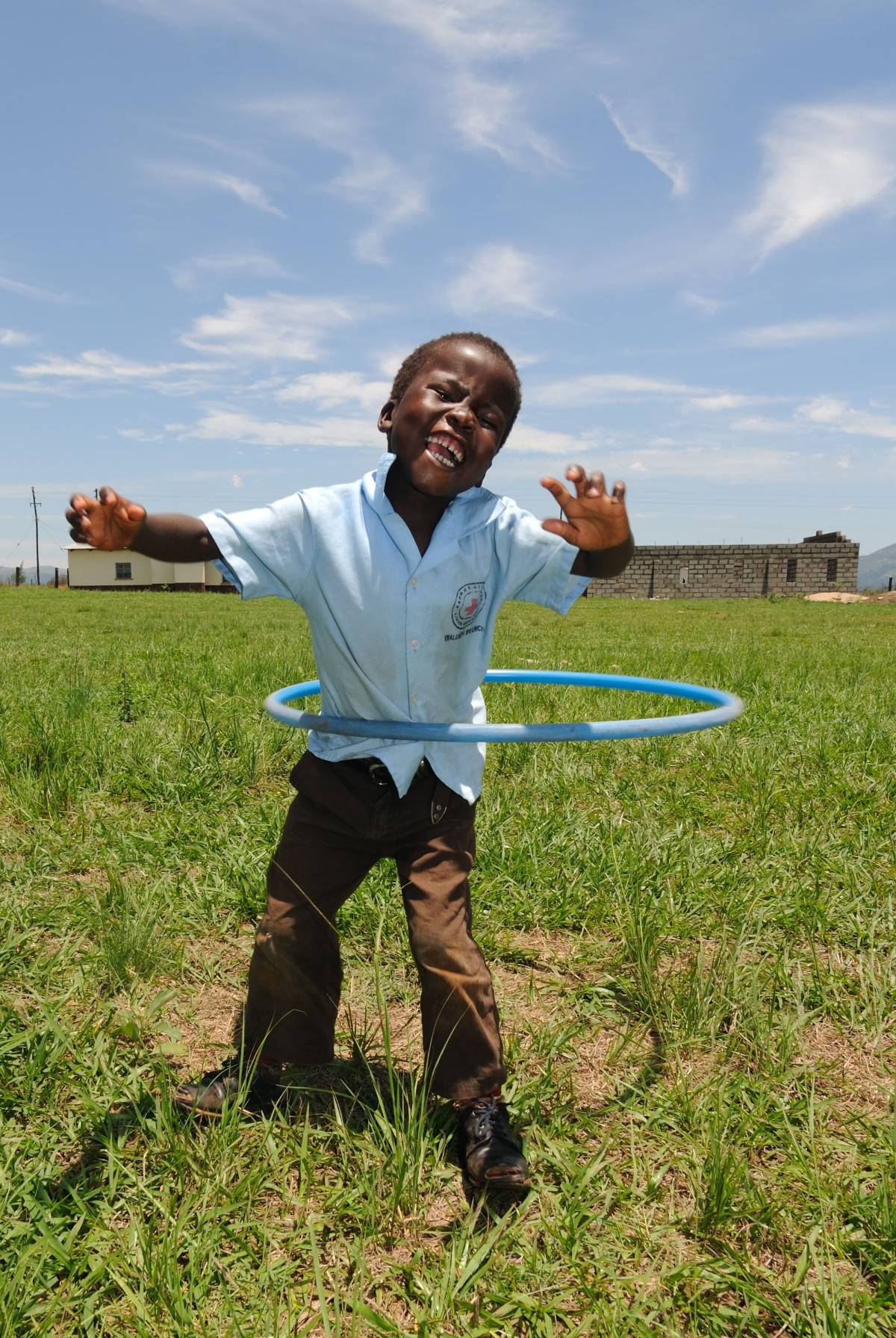 Child playing hula hoop