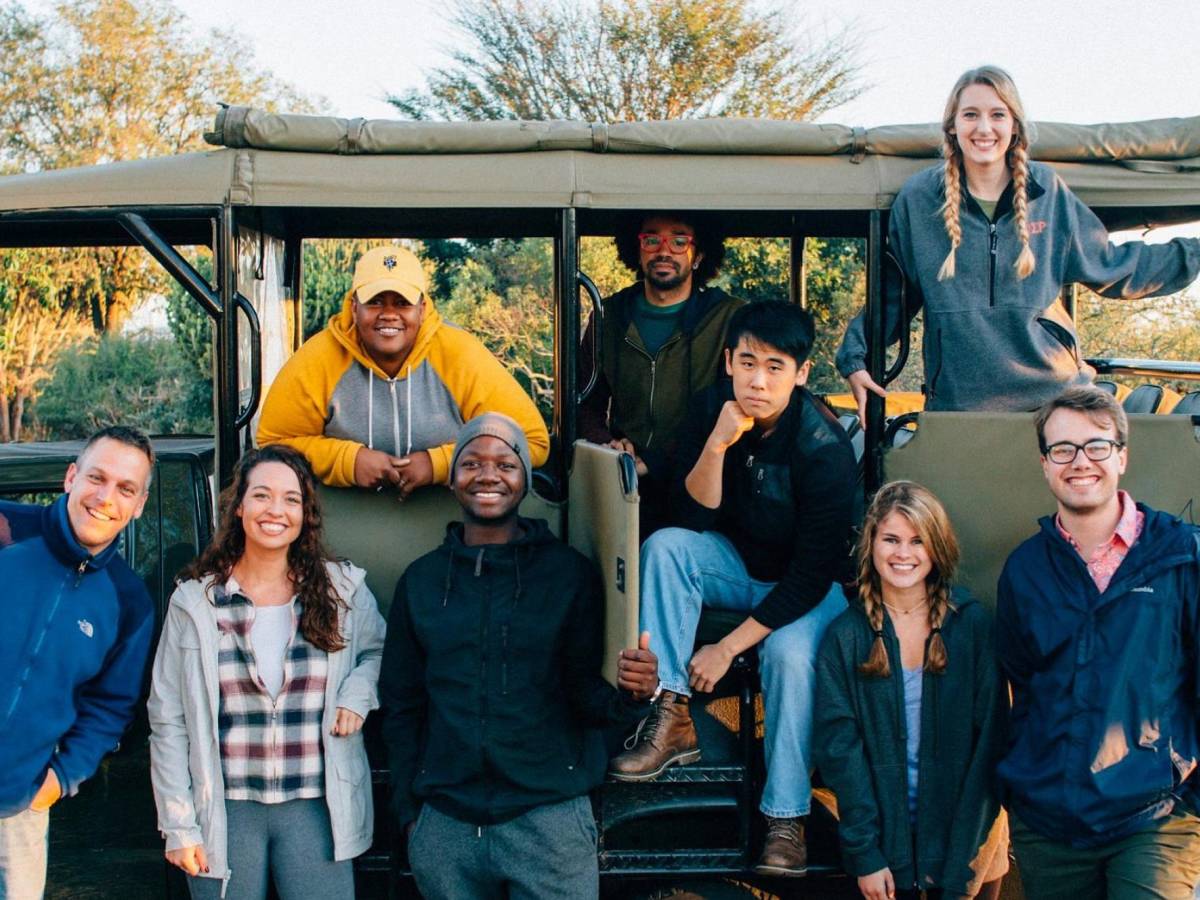 IES Abroad students standing next to a car in Kruger National Park