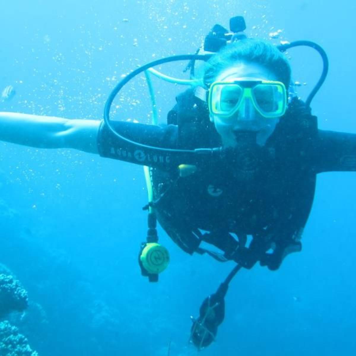 teen scuba diving in great barrier reef