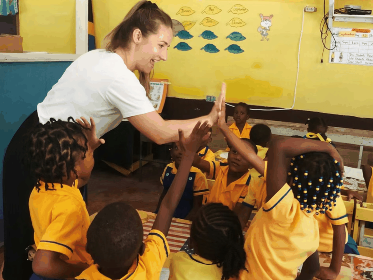 IVHQ Volunteer Celebrating a Students Success in St Mary Jamaica