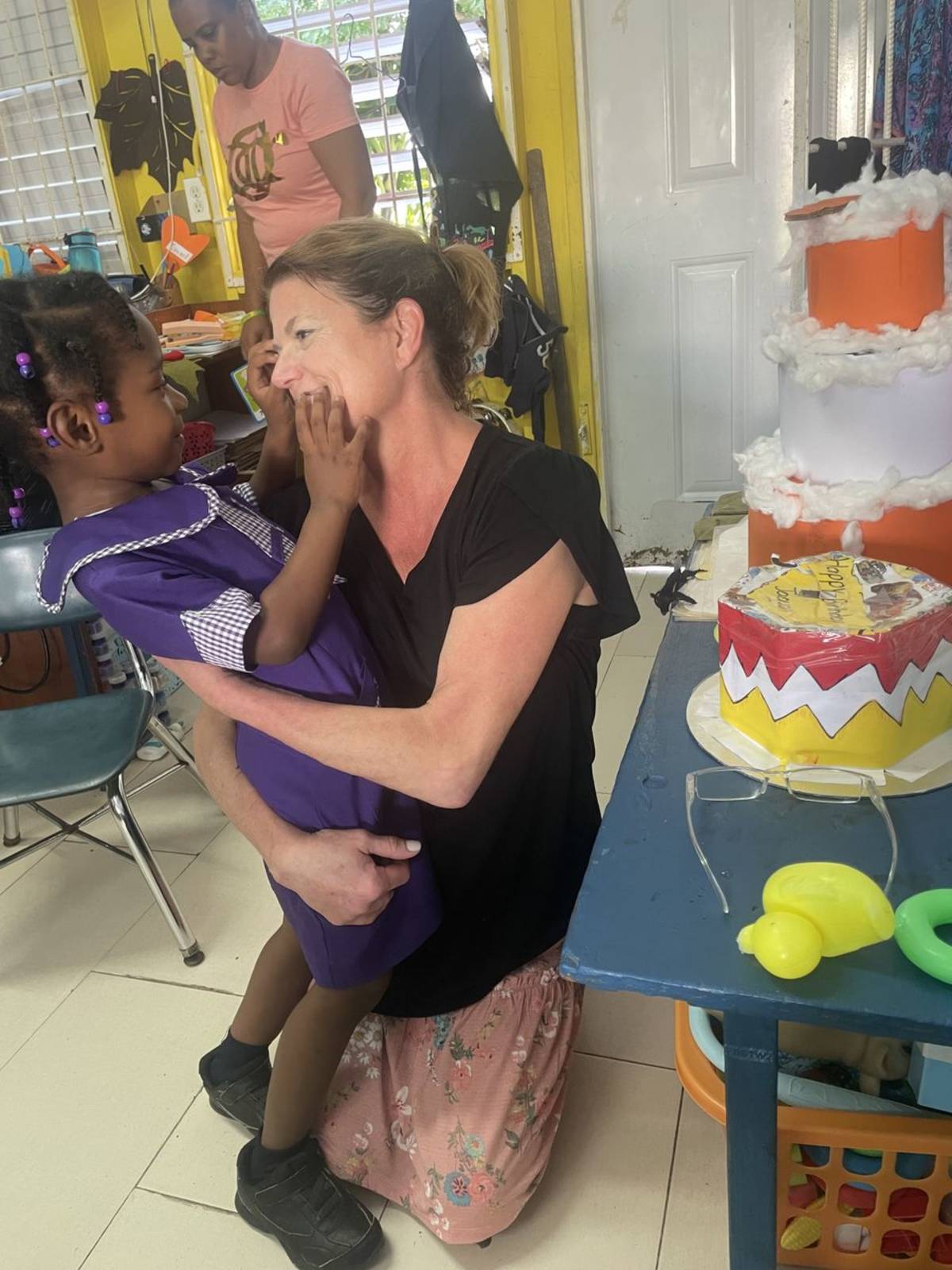 IVHQ Volunteer Helping a Child in St Mary Jamaica
