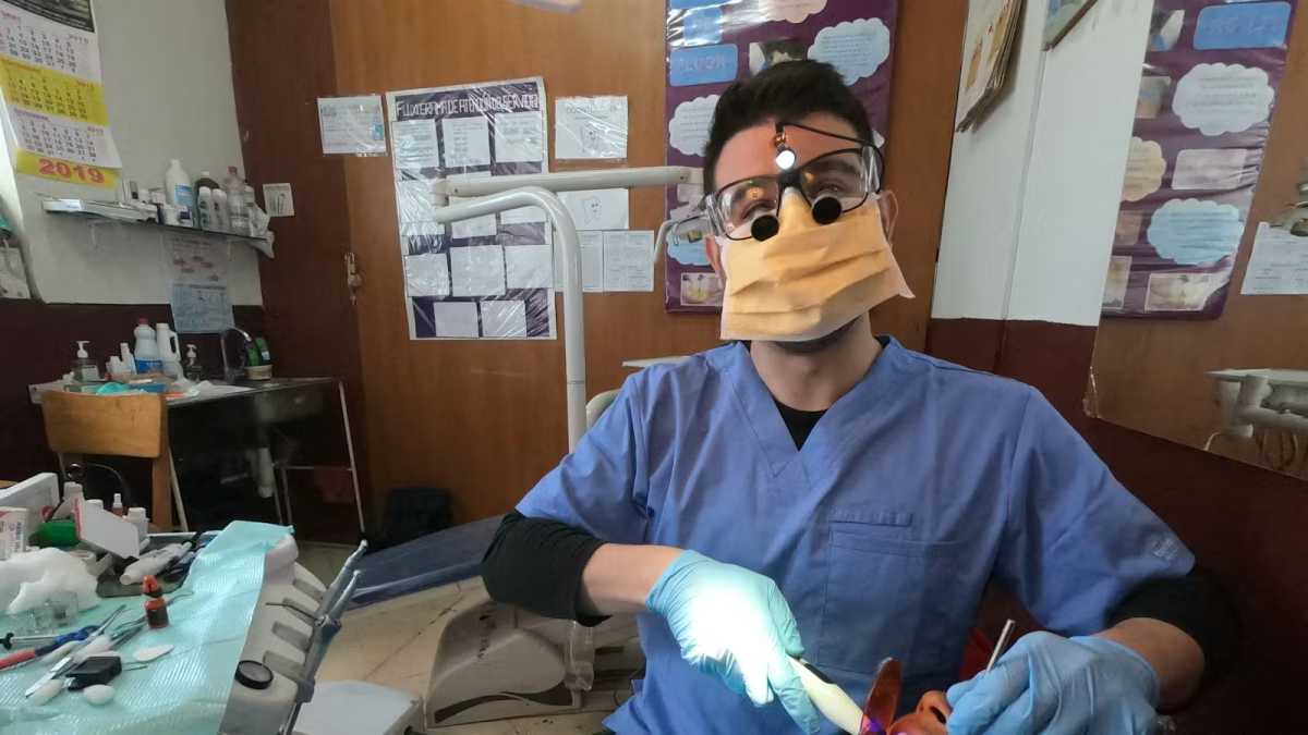 IVHQ Volunteer performing a Dental Checkup on a Patient in Antigua Guatemala