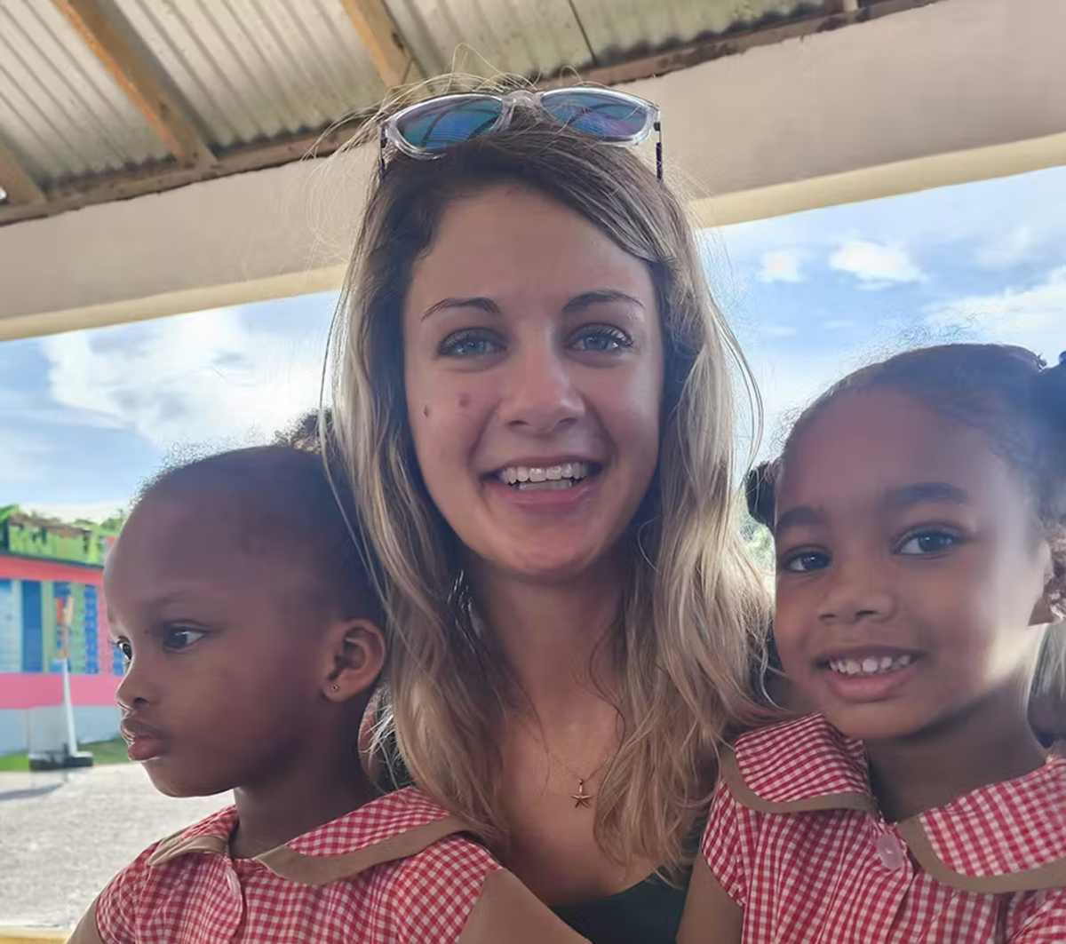 IVHQ Volunteer with two Children in St Mary Jamaica