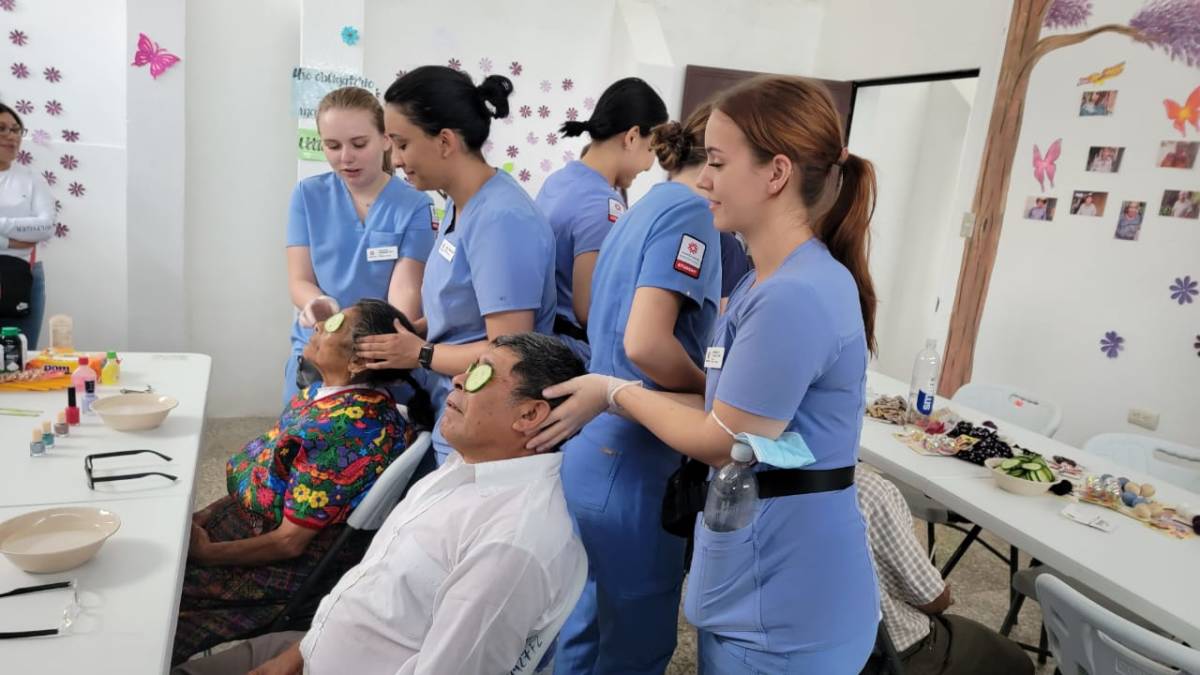 IVHQ Volunteers giving Senior Citizens Massages in Antigua Guatemala