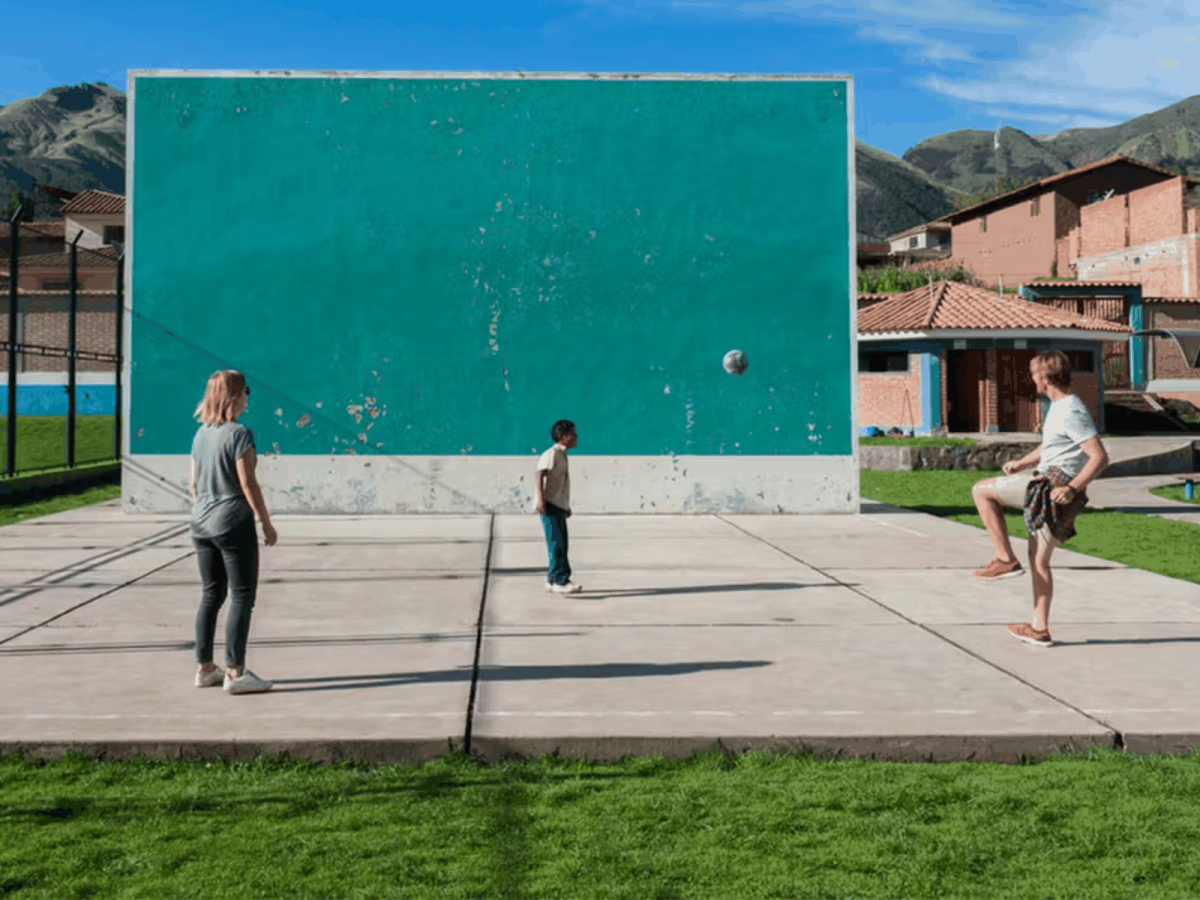 IVHQ Volunteers Playing Football with a Local Child in Jamaica 