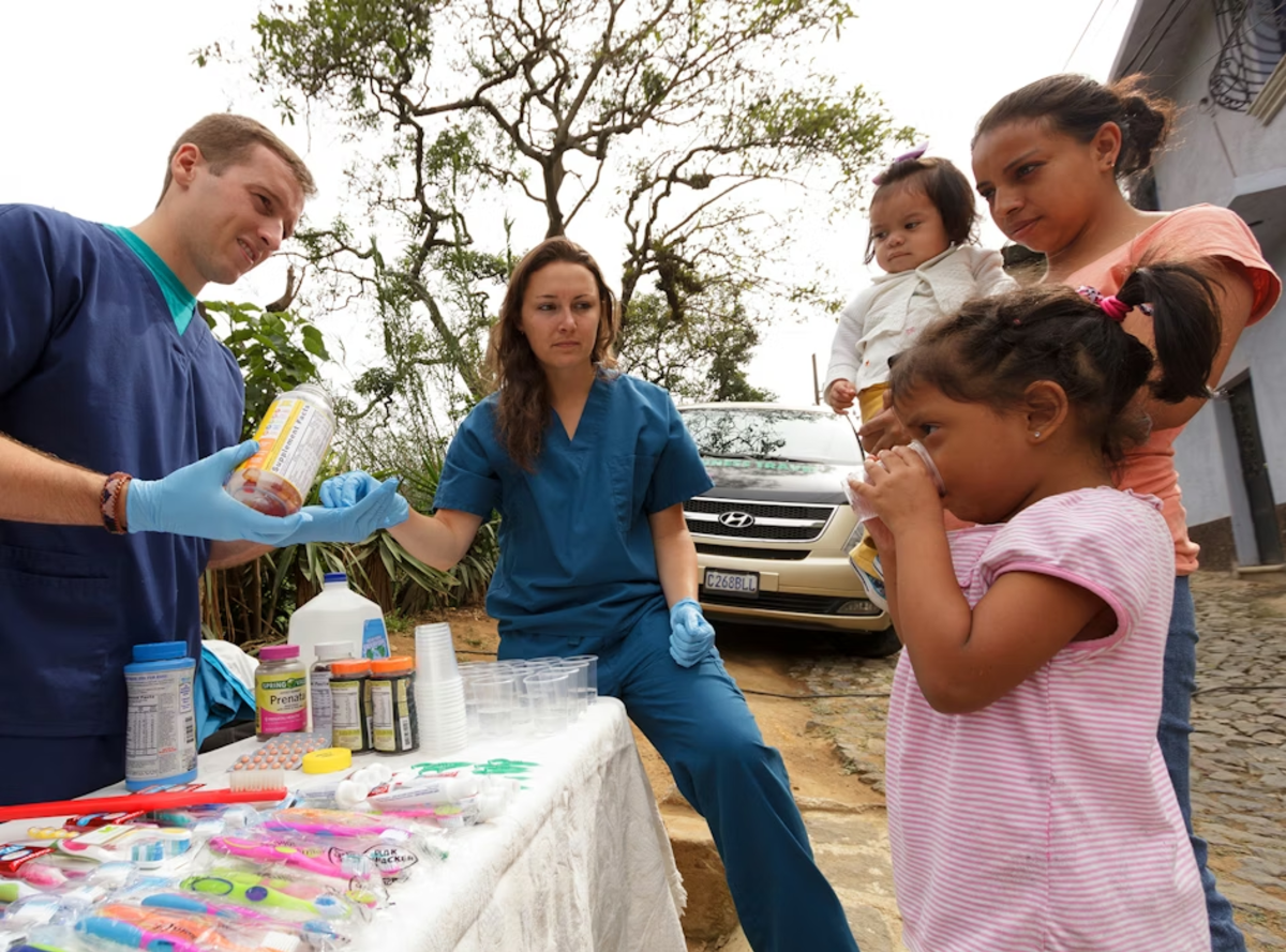IVHQ Volunteers Providing Medication to Children in Antigua Guatemala