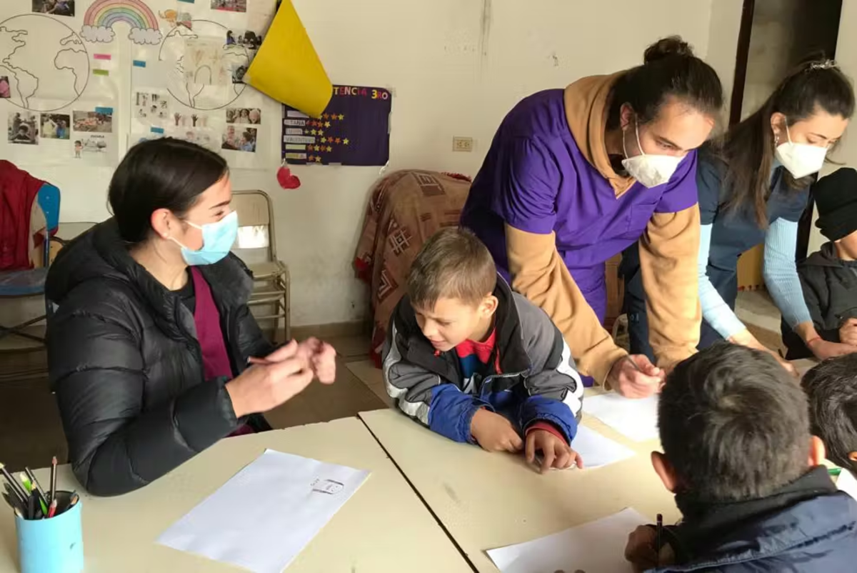 IVHQ Volunteers teaching children about healthcare and medical 