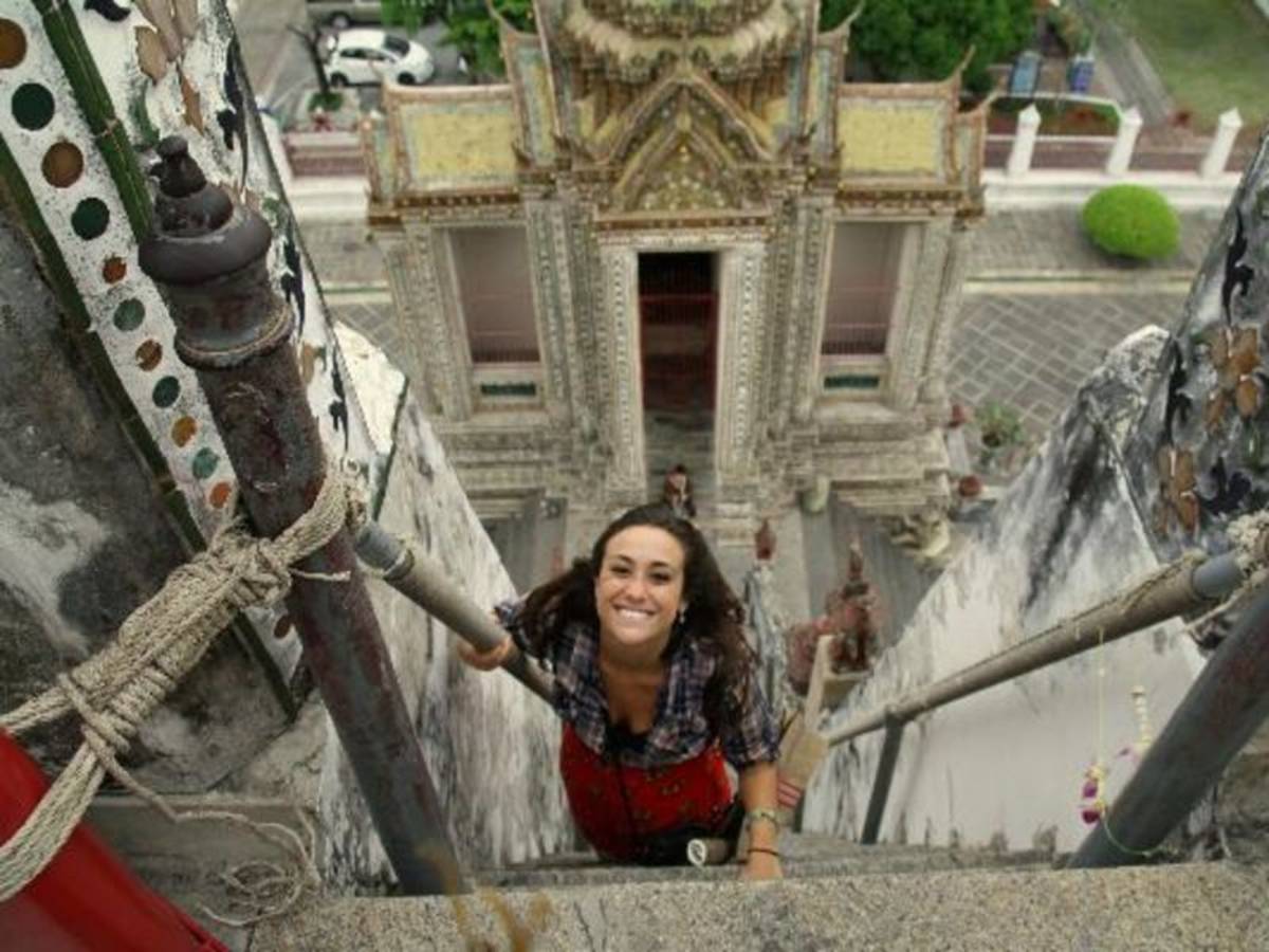 Lady Climbing a high ladder