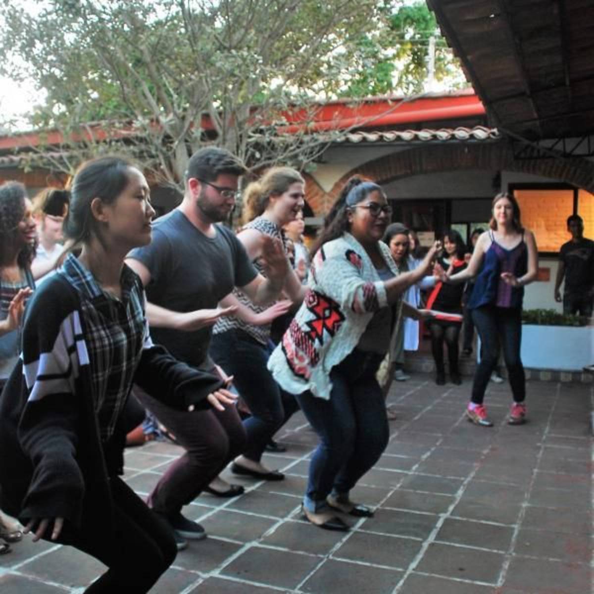 Students learning Latin dance