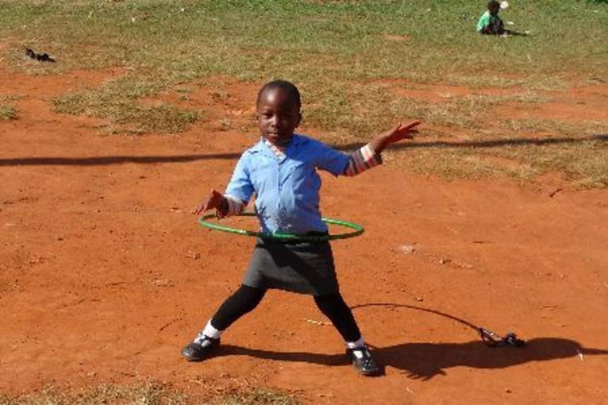 little boy playing hula