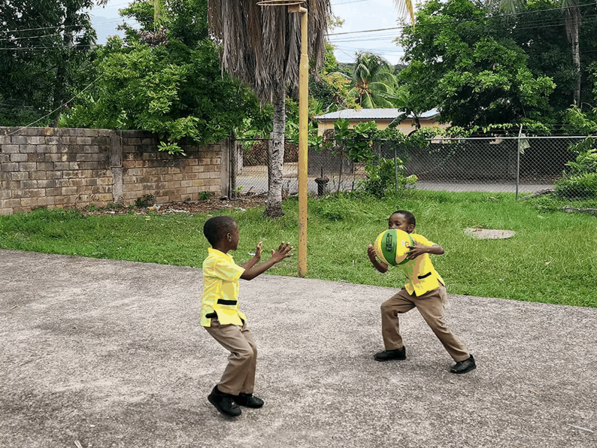 Local Children in Jamaica playing Basketball 