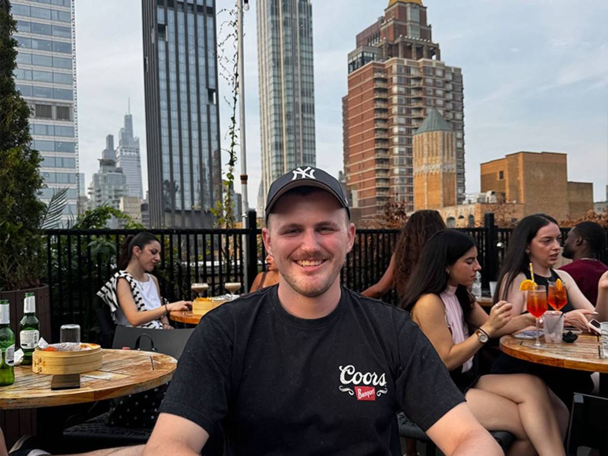 Man with city skyline in the background