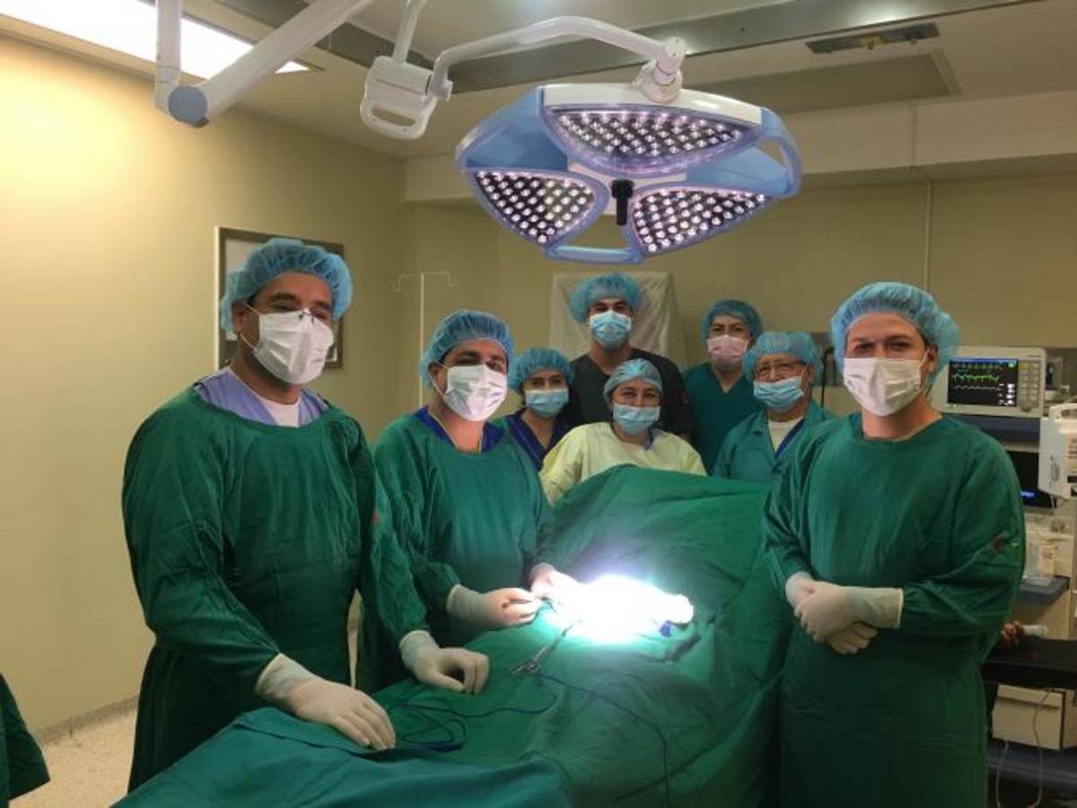Medical intern in surgical scrubs at a healthcare facility in Ecuador, gaining hands-on experience during a surgery-focused medical internship abroad.