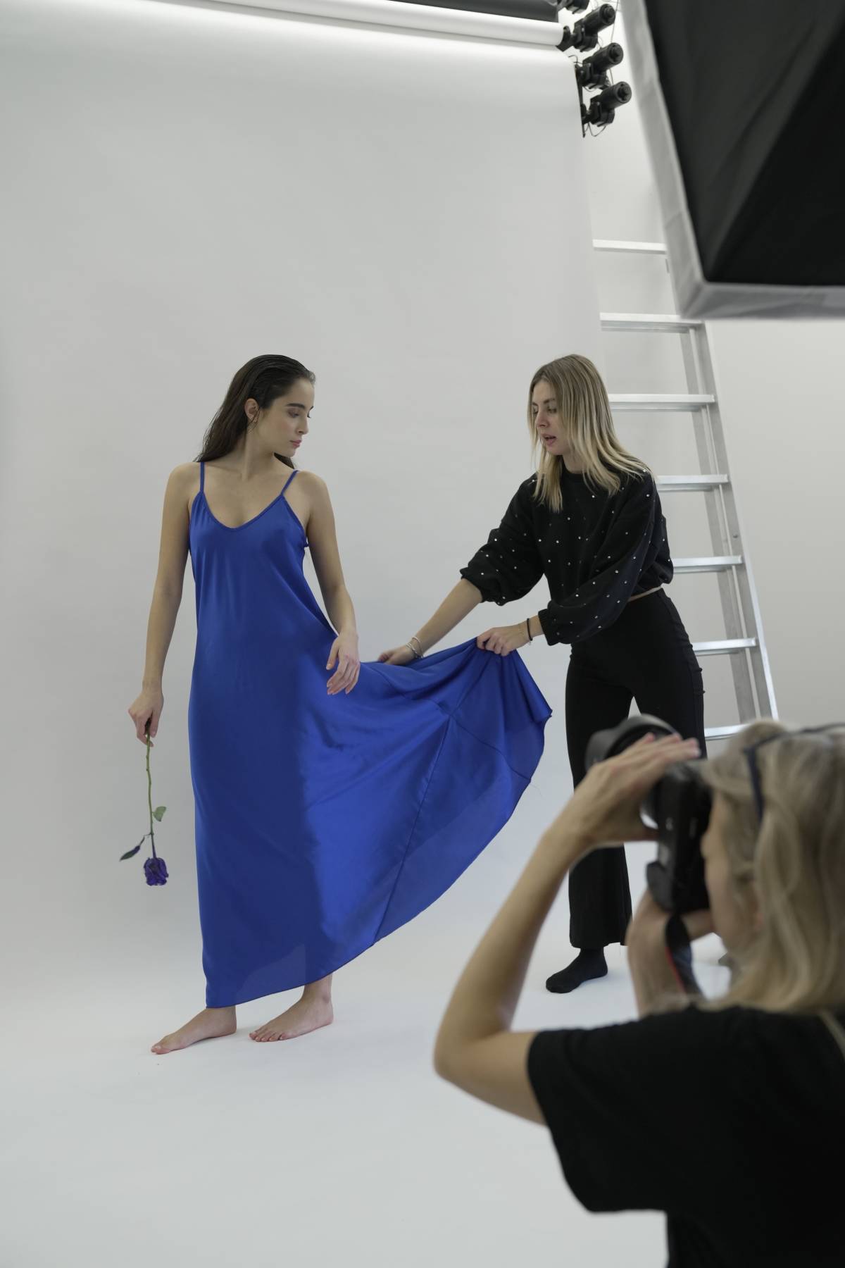 Model, stylist and photographer on set