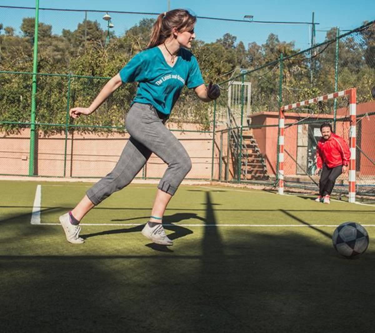 Student playing soccer in rabat
