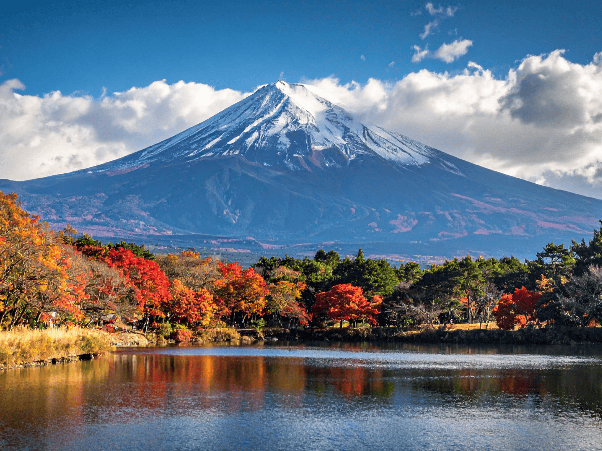 Mount Fuji in Autumn on the banks of a nearby lake