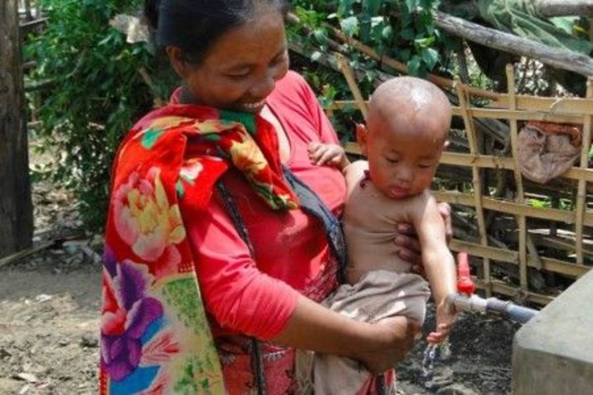 Mother carrying a baby