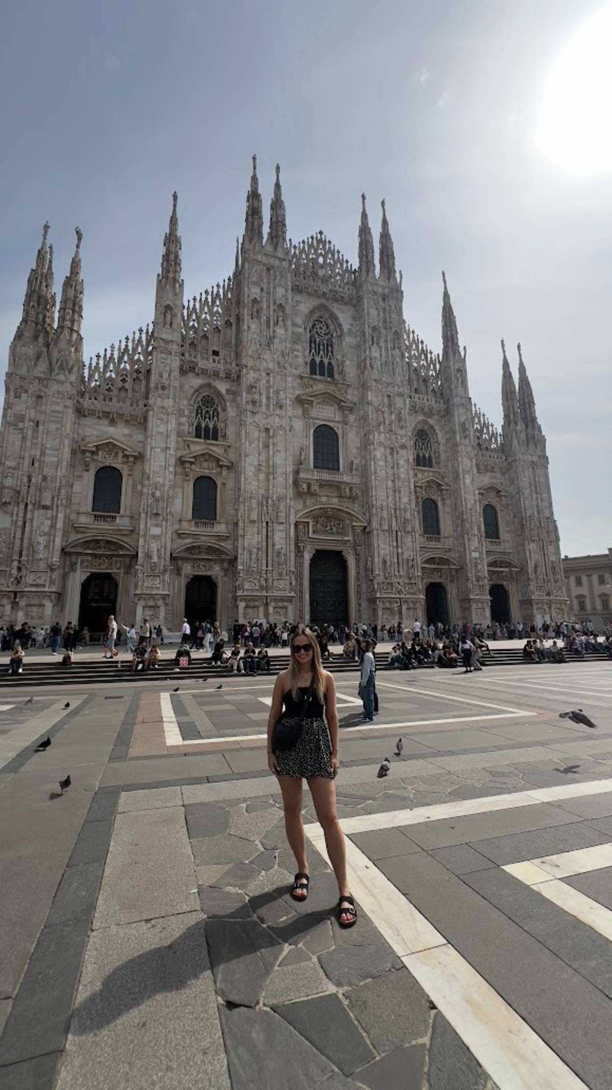 Olivia visiting Duomo in Milan, Italy during a weekend break while living and teaching English abroad in Italy.