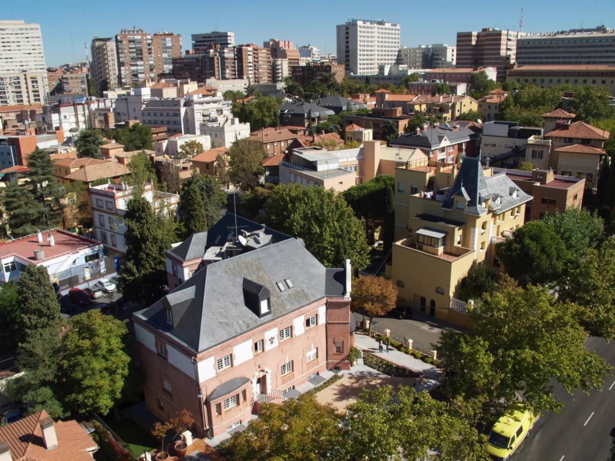 Overhead photo of Padre Arrupe Hall with the city in the background.