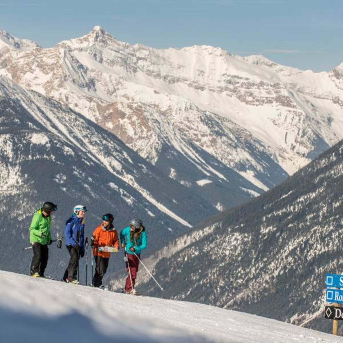 Skiers at the top of the mountain in Canada