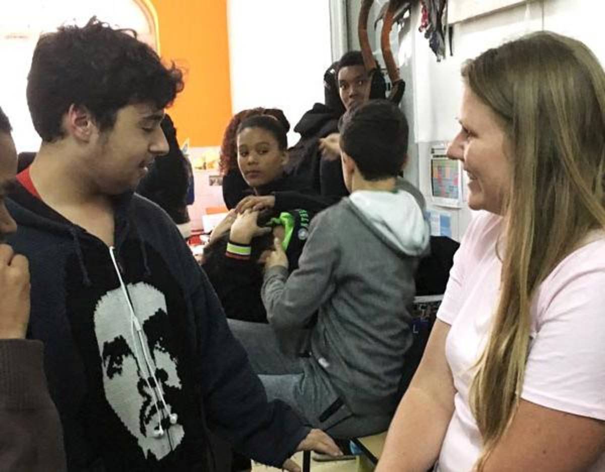 Student talking to a teacher