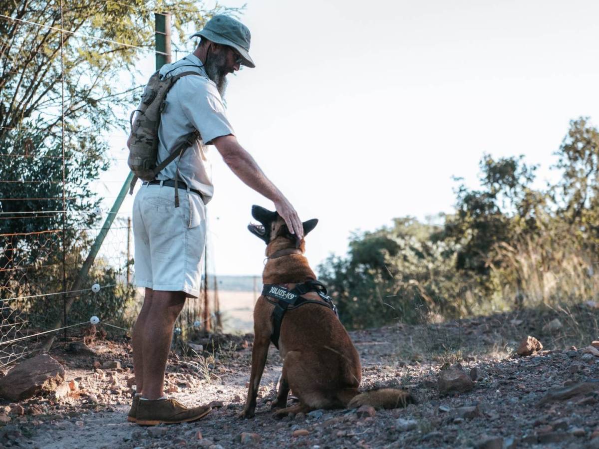 Professional with his anti-poaching dog in the rehabilitation centre