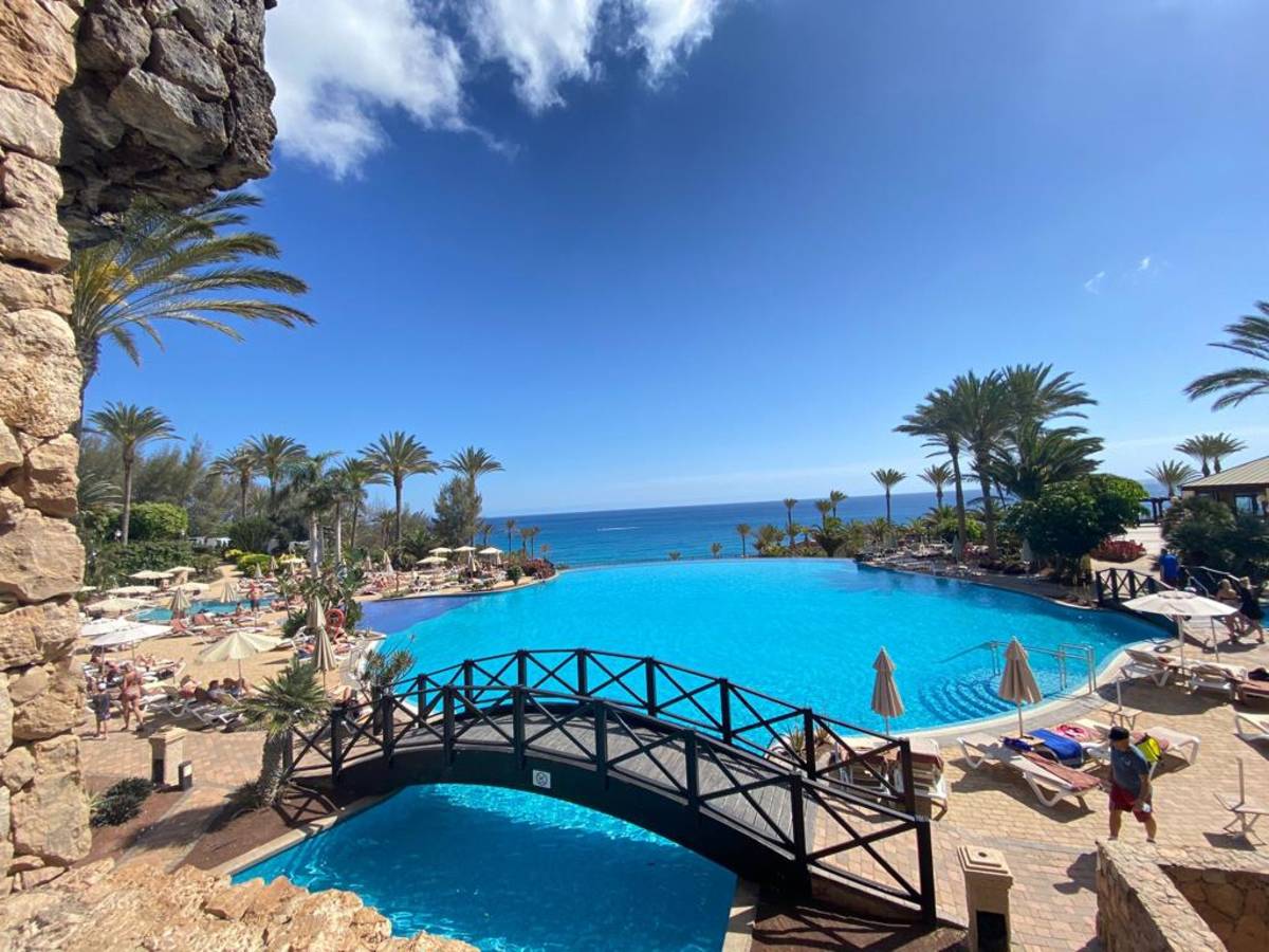 Resort pool by the ocean in Spain, a teacher's perfect retreat.