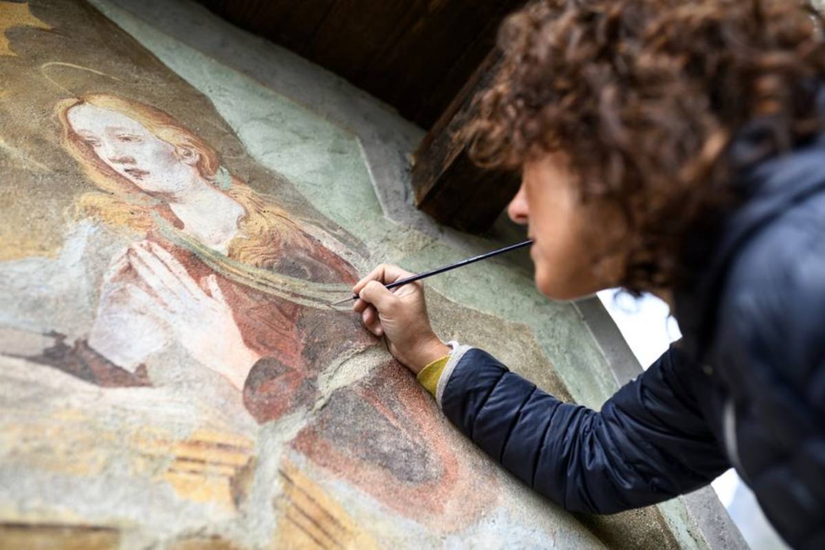 Restoring an old painting in Florence