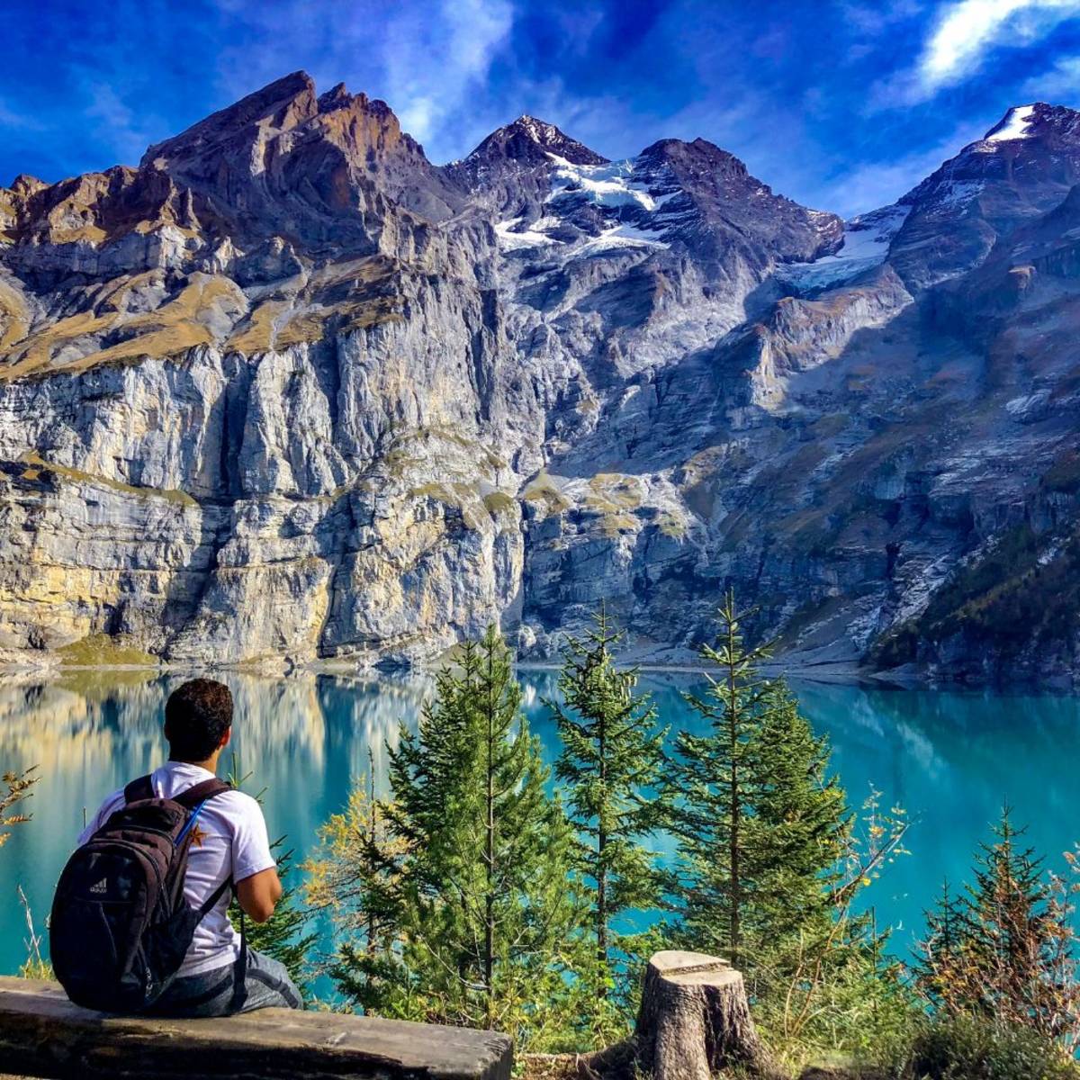 SIT student looking at the view of mountains and a lake in Switzerland.