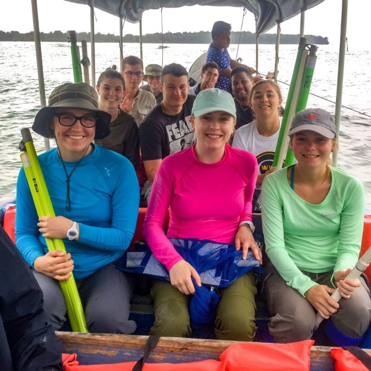 SIT students studying marine science on a boat.